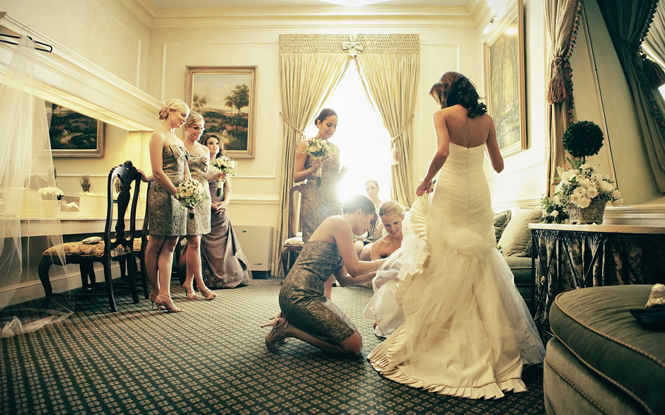 Bridesmaids help this bride get ready in the bridal chambers of a country club in Pennsylvania