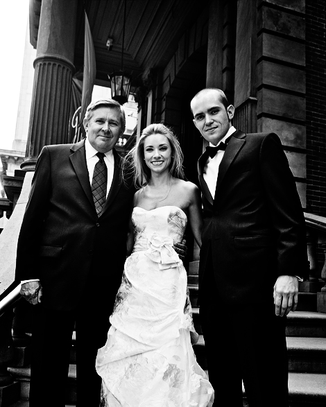 The bride poses with her dad and brother before her Philadelphia wedding at the Union League