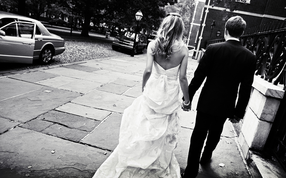 The bride and groom look elegant and beautiful walking around the cobblestone streets of Philadelphia before their wedding, photographer:  Peter Van Beever